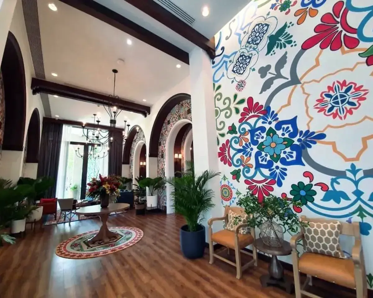Stylish communal lounge area with floral wall art