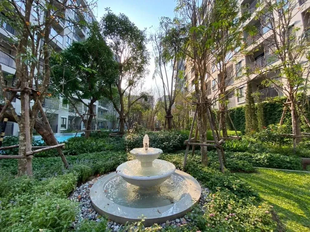 Lush tropical landscaped garden and water fountain